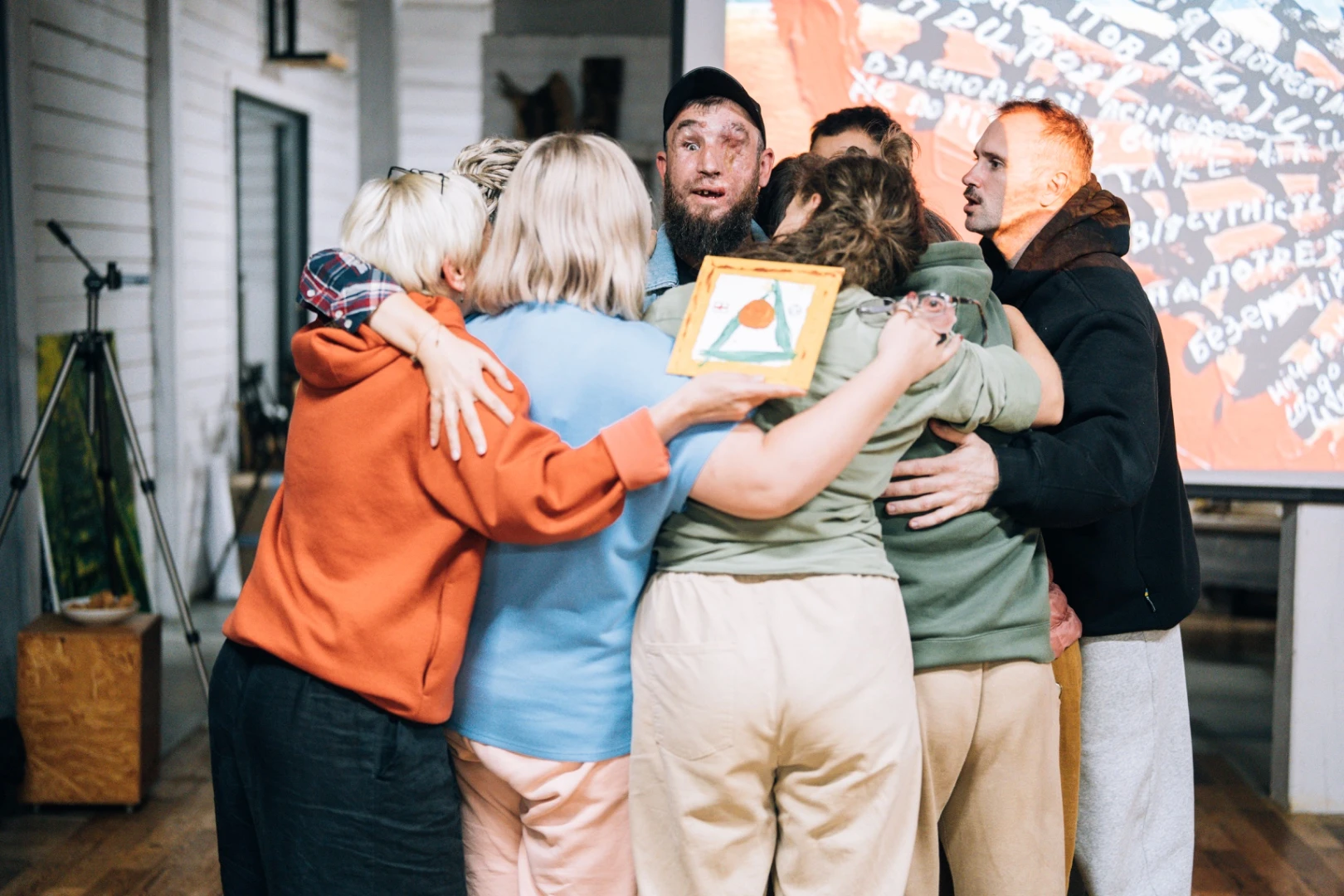 A group embrace indoors
