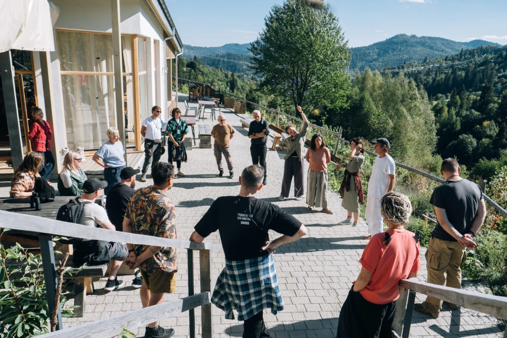 A group circle on the terrace overlooking the mountains
